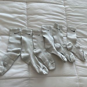 Assortment of white Nike dri fit socks